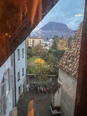 a view from a window of a building with bikes at Holy View Apartment in Bolzano
