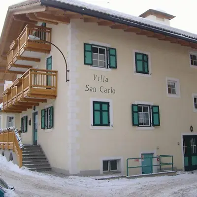 a building with a sign that reads villa san carlos at Villa San Carlo in Pozza di Fassa