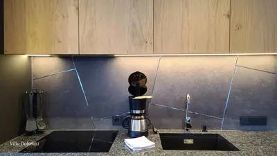 a kitchen counter with a coffee maker and a sink at Villa Dolomiti in Ortisei