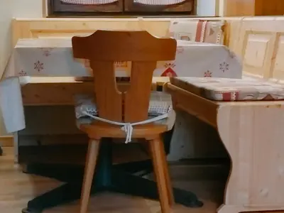 a wooden desk with a chair next to a bed at CasaMau Bilo in Pera