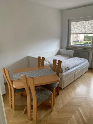 a dining room with a table and a bed at Appartamento del CONTE a Merano, con piscina, leggere attentamente le info o chiamare direttamente l'host! in Merano