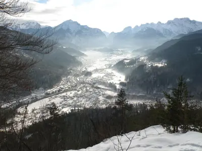 a view of a valley in the mountains with snow at Appartamento Elisa in Taibon