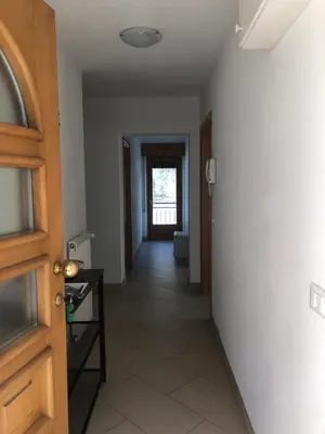 a hallway with a door leading to a room at Appartamento Elisa in Taibon