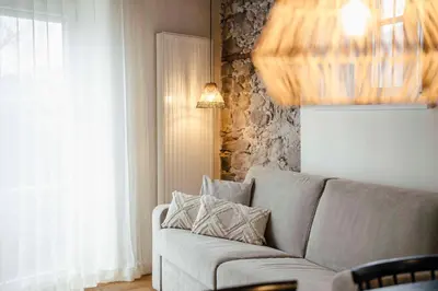 a living room with a couch and a window at Karcher-Hof Terlan in Terlano