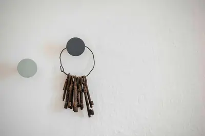 a bunch of sticks hanging on a wall at Karcher-Hof Terlan in Terlano