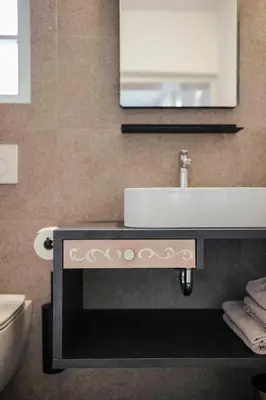 a bathroom with a sink and a mirror at Karcher-Hof Terlan in Terlano