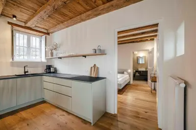 a kitchen with a sink and a counter top at Karcher-Hof Terlan in Terlano