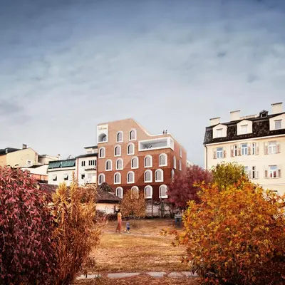 a group of buildings in a city with trees at Hotel La Briosa in Bolzano