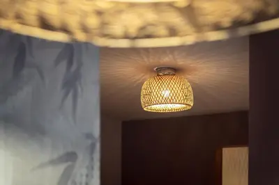 a lamp hanging from a ceiling in a room at Ciasa Buro - Coba in Moena