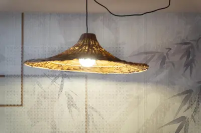 a light fixture hanging from a glass window at Ciasa Buro - Coba in Moena
