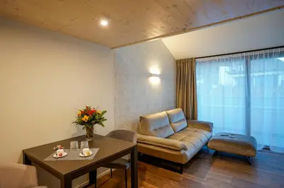 a living room with a couch and a table at Your Stay in Bolzano in Bolzano