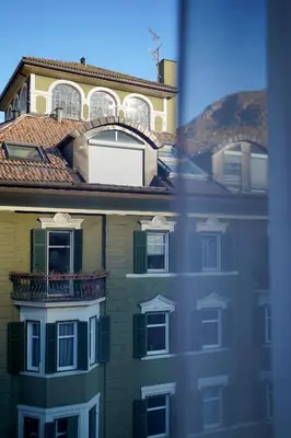 a building with a balcony on top of it at Your Stay in Bolzano in Bolzano