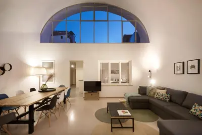 a living room with a couch and a table at Argentieri City Loft in Bolzano