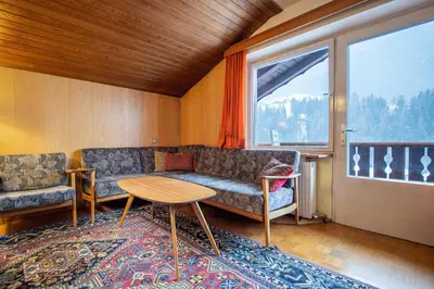 a living room with a couch and a table at Apartments Karl in Ortisei