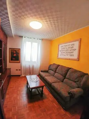 a living room with a couch and a coffee table at da Stoimenov in Fondo