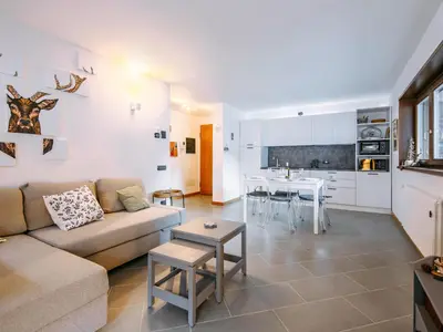 a living room with a couch and a table at Apartment Appartamento 29 by Interhome in Alba di Canazei