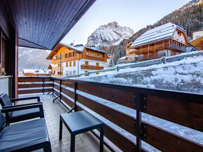 a balcony with chairs and a view of a mountain at Apartment Appartamento 29 by Interhome in Alba di Canazei