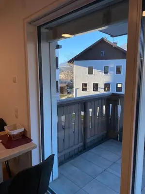 a balcony with a view of a building at Via hofer in Brunico