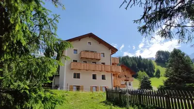 a house on a hill with a fence at Villa Erica in Badia