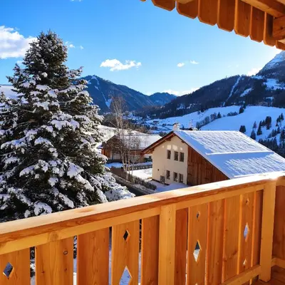 a view from the deck of a cabin with a christmas tree at Villa Erica in Badia