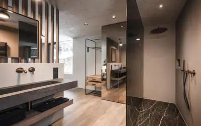 a bathroom with a shower and a sink at Avita Loft by Avita suites to relax in Santa Cristina in Val Gardena