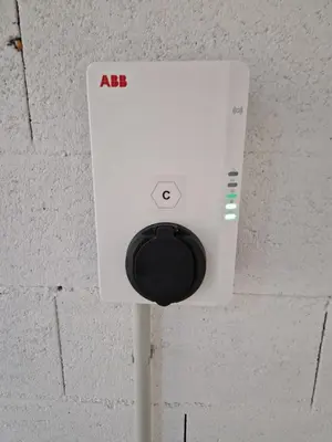 a white ac unit on a brick wall at M&M-Apartment in Brunico
