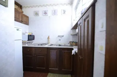 a kitchen with a sink and a microwave at Cà Mughi Studio in Zuel