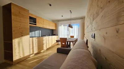a living room with a couch and a table at Chalet Soredlin in La Valle