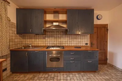 a bathroom with a shower and a toilet and a sink at Casa Da l Oio in Cortina dʼAmpezzo
