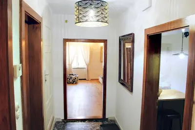 a hallway with a door leading to a room at Cirillo Guesthouse in Cortaccia