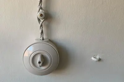 a white toilet hanging on a wall at Cirillo Guesthouse in Cortaccia