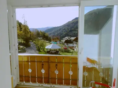 a window with a view of a mountain view at Ciasa Gran Panorama Moena in Moena