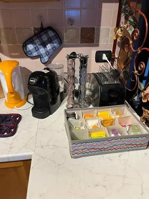 a kitchen counter with a tray filled with food at Casa De Lotto in San Vito di Cadore