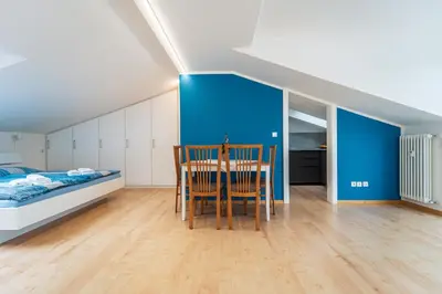 a room with a table and chairs and a bed at Mias Apartments - #MiasEppan#Badl in Appiano sulla Strada del Vino