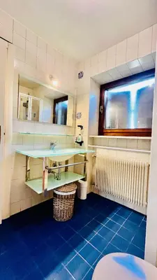 a bathroom with a sink and a mirror at PredazzoHouse in Predazzo
