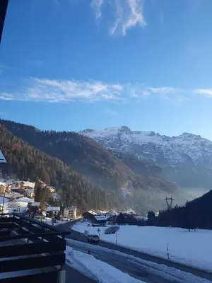 a view of a town in the snow with mountains at Casa FALCADE DOLOMITI in Canale dʼAgordo