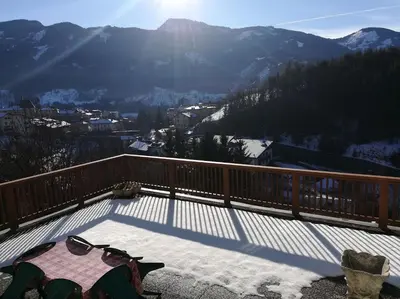 a balcony with a view of a snow covered mountain at Appartamento Flora in Tesero