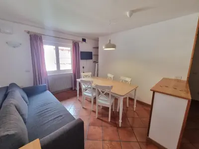 a living room with a couch and a table at Fraines in Alba di Canazei