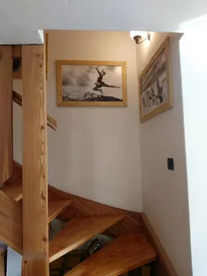 a staircase in a house with wooden floors at APPARTAMENTO CORTINA 1956 in Cortina dʼAmpezzo