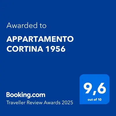 a blue sign with the text awarded to apartmentento confirmatio at APPARTAMENTO CORTINA 1956 in Cortina dʼAmpezzo