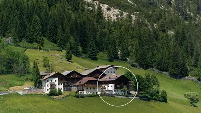 an aerial view of a large house on a hill at Appartements ai Sanc in Corvara in Badia