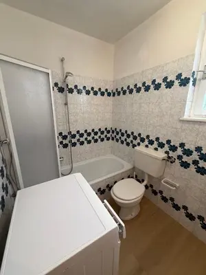 a bathroom with a toilet and a tub and a sink at Appartamento Scacciapensieri in Meida