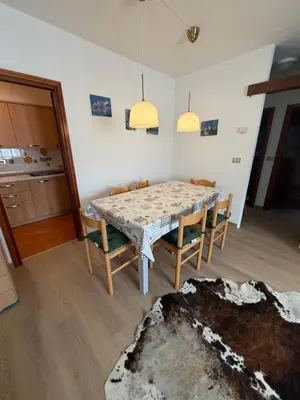 a dining room with a table and chairs at Appartamento Scacciapensieri in Meida