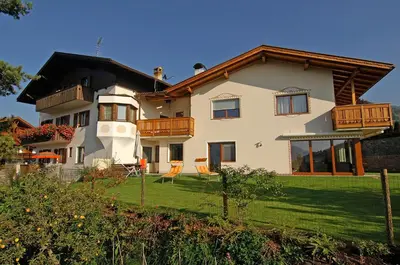 a house on a hill with a yard at Haus Ploner in Castelrotto