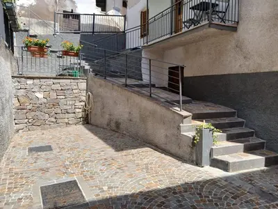 a small village on a hill with vineyards at App. Valentina in Segonzano