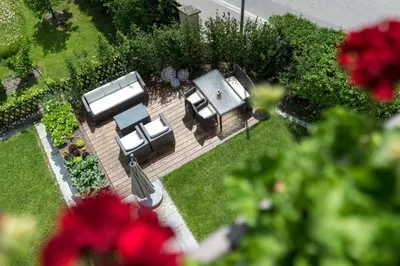 an overhead view of a garden with tables and chairs at Adlhof Apartments in Brunico