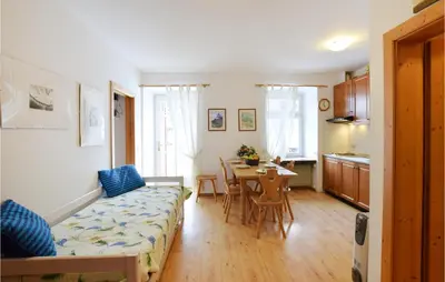 a living room with a couch and a table at Amazing Apartment In Località Carbonin in Carbonin