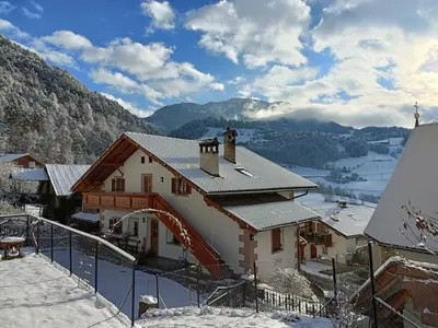 a house in the snow with a view at Gosthof Kastelruth in Castelrotto