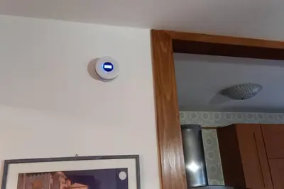 a security camera on a wall next to a picture at Appartamento La Casa di Violetta in Tonadico