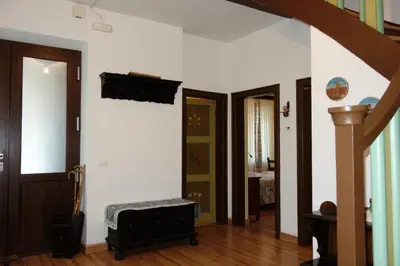 a room with a hallway with two doors and a suitcase at Villa Molteni, Ville di Fiemme, Varena in Varena